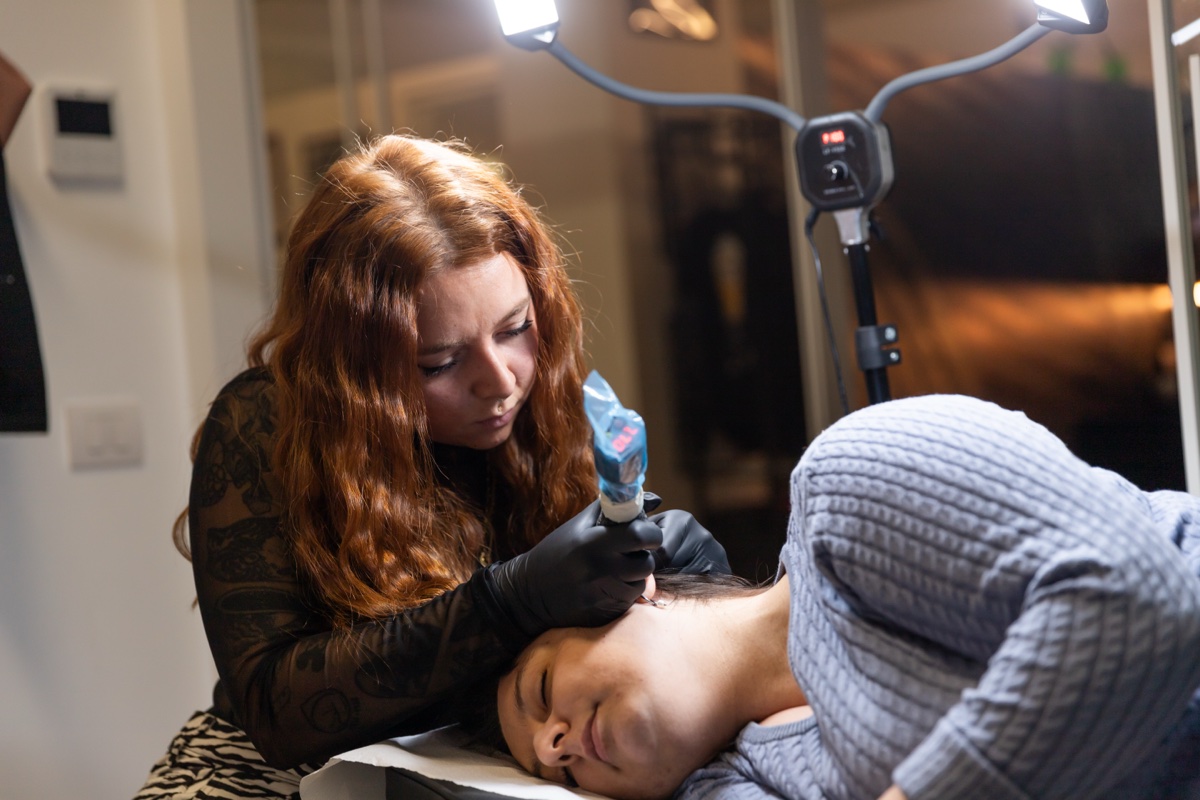 Alissa Tattooing Background